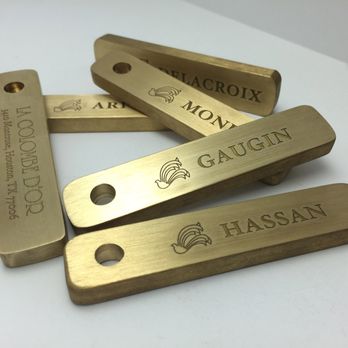 Prince Customs - Deep engraving on brass room tags using the laser. - Machine Shops Near Me - Houston, Texas