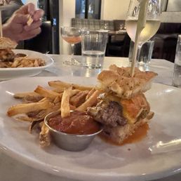 Half of the patty melt with fries
