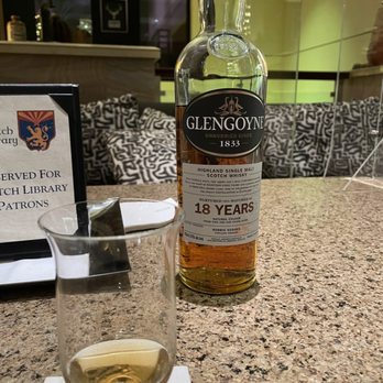 The Scotch Library - a bottle of glengoynee and a glass of whisky - Cocktail Bars Near Me - Scottsdale, Arizona