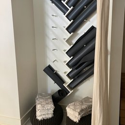 a view of a wall of hair dryers