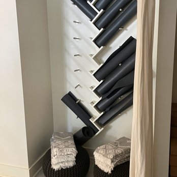 Otium Savannah - a view of a wall of hair dryers - Yoga Near Me - Savannah, Georgia