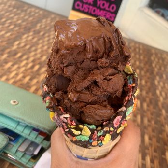 Yolo Yogurt & Desserts - a hand holding an ice cream cone - Ice Cream & Frozen Yogurt Near Me - Roslyn, New York Yolo Yogurt & Desserts - a hand holding an ice cream cone - Ice Cream & Frozen Yogurt Near Me - Roslyn, New York