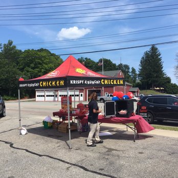 Chucky's E G P - a woman standing under a red tent - Grocery Near Me - Norwich, Connecticut