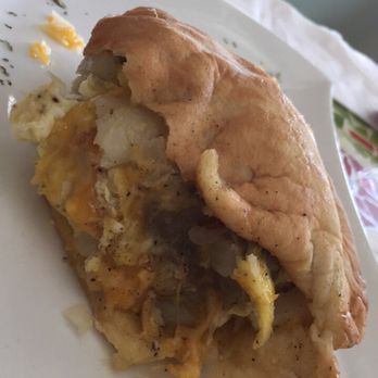 Cafe Veneto - Half eaten omelette with potatoes and turkey sausage - Breakfast & Brunch Near Me - Jacksonville, Florida