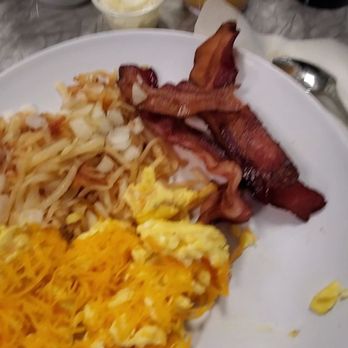 Delaney's Diner - Eggs with a cheddar cheese on top, hash Browns with onions, bacon and Orange juice. - Breakfast & Brunch Near Me - Westerville, Ohio