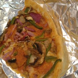 a slice of pizza on tin foil