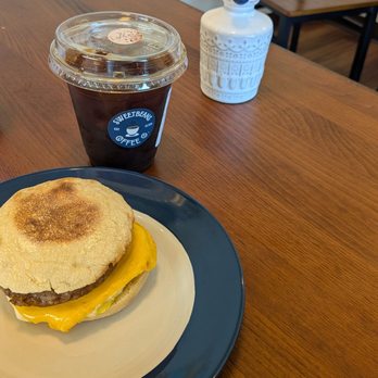 Sweetbeans Coffee - Iced coffee and sausage English muffin breakfast sandwich - Coffee Roasteries Near Me - Omaha, Nebraska Sweetbeans Coffee - Iced coffee and sausage English muffin breakfast sandwich - Coffee Roasteries Near Me - Omaha, Nebraska