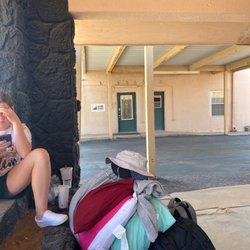 Budget Inn Of Brownfield - My kid waiting next to all our stuff and their crap little office door in the back ground.