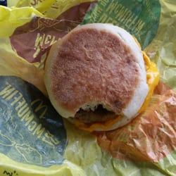 McDonald's - A bite out of his mcmuffin. We clearly won't be eating it and we won't be returning here ever.