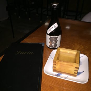 JuRin - a table with a bottle of beer and a wooden box - Sushi Bars Near Me - Geneva, Illinois JuRin - a table with a bottle of beer and a wooden box - Sushi Bars Near Me - Geneva, Illinois