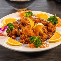 Hokkaido Sushi Asian Bistro - Sweet, zesty, and crunchy, Orange Chicken made with juicy white meat.