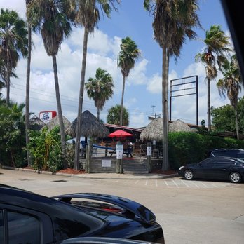 Capt. Benny's - a parking lot with palm trees - Seafood Near Me - Houston, Texas Capt. Benny's - a parking lot with palm trees - Seafood Near Me - Houston, Texas