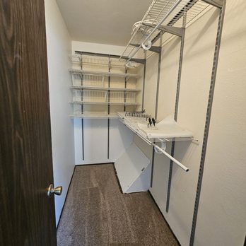 Carpet Club - a walk - in closet with shelves and a sink - Carpeting Near Me - Escondido, California Carpet Club - a walk - in closet with shelves and a sink - Carpeting Near Me - Escondido, California