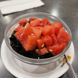 a bowl of watermelon and blackberries