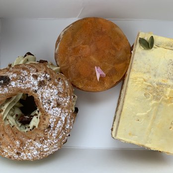 Left Bank Pastry - Paris Brest (left, like a cream puff with pistachio), Apricot Rose Tart (middle, so good!) and Opera Cake - Bakeries Near Me - Olympia, Washington Left Bank Pastry - Paris Brest (left, like a cream puff with pistachio), Apricot Rose Tart (middle, so good!) and Opera Cake - Bakeries Near Me - Olympia, Washington