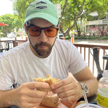 Plate - My boyfriend eating a wrap - Sandwiches Near Me - Miami, Florida