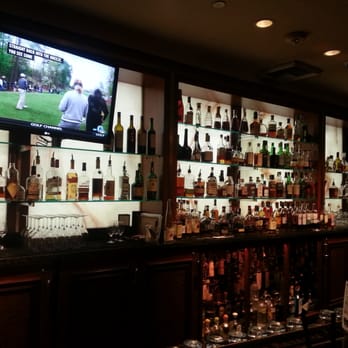 Lit Cigar Lounge - Closer bar shot, drink guide has prices which is nice - Lounges Near Me - Snoqualmie, Washington