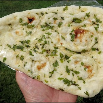 Naan Tikka - A slice of heaven... a slice of " Garlic Naan Bread" freshly baked from Naan Tikka, with lots of garlic, cilantro, and plenty of flavor. - Pakistani Near Me - Sacramento, California Naan Tikka - A slice of heaven... a slice of " Garlic Naan Bread" freshly baked from Naan Tikka, with lots of garlic, cilantro, and plenty of flavor. - Pakistani Near Me - Sacramento, California