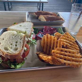 Easy Tiger - South Lamar - BLT with Chicken, side of waffle fries and Lavender Lemonade (alcohol) - Bakeries Near Me - Austin, Texas Easy Tiger - South Lamar - BLT with Chicken, side of waffle fries and Lavender Lemonade (alcohol) - Bakeries Near Me - Austin, Texas