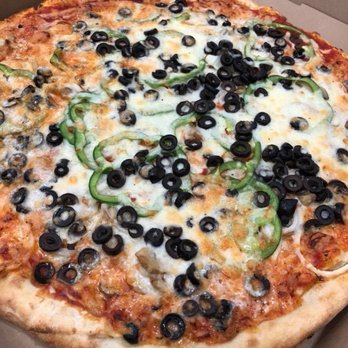 Basil - a pizza with black olives and peppers - Pizza Near Me - Minneapolis, Minnesota