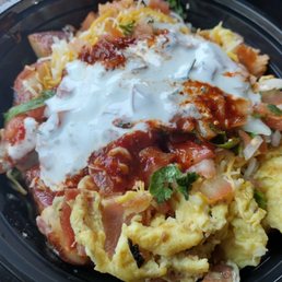 Breakfast bowl with eggs and bacon, pico de Gallo, rice, potatoes, cheese, cheese sour cream, and salsa Breakfast bowl with eggs and bacon, pico de Gallo, rice, potatoes, cheese, cheese sour cream, and salsa