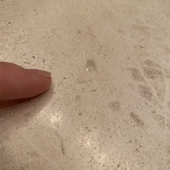 Sir Grout Seattle - Left a few drops of non-removable filler on the counter top. - Tiling Near Me
