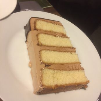 D'Vine Cuisine - Hazelnut vanilla cake with Nutella buttercream and chocolate ganache - Caterers Near Me - Bryan, Texas D'Vine Cuisine - Hazelnut vanilla cake with Nutella buttercream and chocolate ganache - Caterers Near Me - Bryan, Texas