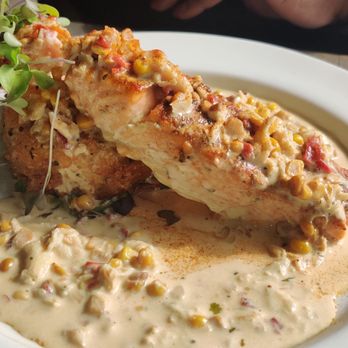 Swill By Blacksmiths - Blackened Salmon & Fried Grits in MD Crab Cream Sauce - Cafes Near Me - Baltimore, Maryland