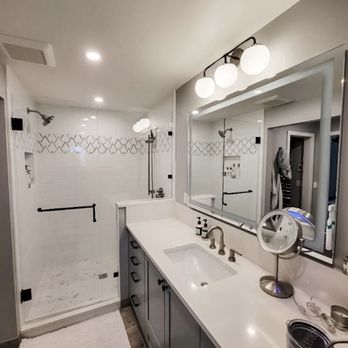 1. Evergreen Shower Door & Mirror