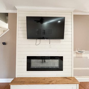 Nordic Builders - a flat screen tv mounted above a fireplace - General Contractors Near Me - Fort Mill, South Carolina Nordic Builders - a flat screen tv mounted above a fireplace - General Contractors Near Me - Fort Mill, South Carolina