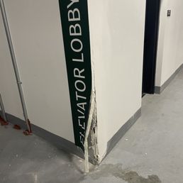 Someone ran into the wall due to no mirror on this corner Someone ran into the wall due to no mirror on this corner