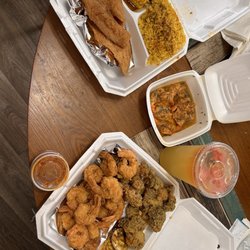 Seafood Cafe - 1 Dozen Shrimp 1 Pieces Tilapia and 6 Pieces Shrimp Fried Broccoli Corn on The Cob Yellow Rice Homemade Strawberry Lemonade