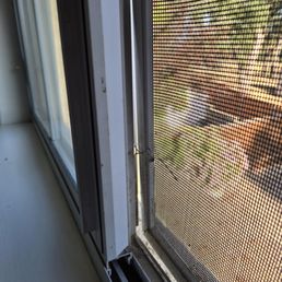 Huge gap and paper clip holding frame in window Huge gap and paper clip holding frame in window
