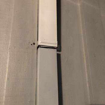 Rain Master seamless gutters - Example of their shoddy work. The downspout is cut in half (why? Why?), the two pieces don't even match & they put a big hole in my house. - Gutter Services Near Me - Antelope, California Rain Master seamless gutters - Example of their shoddy work. The downspout is cut in half (why? Why?), the two pieces don't even match & they put a big hole in my house. - Gutter Services Near Me - Antelope, California