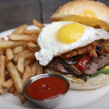 D'antigua - a burger and fries on a plate - Music Venues Near Me - Queens, New York