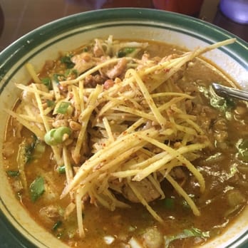 Thai Erawan Restaurant - Dressing Noodles -- a unique Thai dish with chicken, fresh ginger, and rice noodles, served in a broth with lemongrass and ginger notes. - Thai Near Me - Yorktown, Virginia