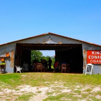 Luscombre Farm - a group of people sitting outside of a building - Specialty Food Near Me - Anna, Texas