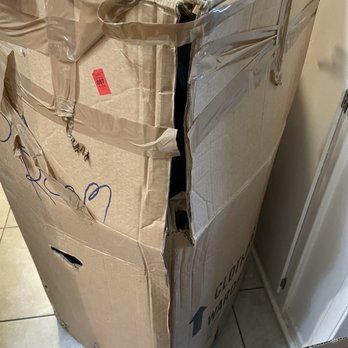 Got2Move - Damaged wardrobe box that contained my $800 computer monitor. Packed with clothes and hangers. - Movers Near Me