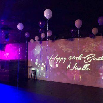The SOL Venue - Purple lighting to match my decor and the image projected on the wall, and DJ booth. - Music Venues Near Me - Carson, California