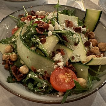 Harvest Tide Steakhouse Restaurant - BABY ARUGULA ZUCCHINI - Feta Cheese | Baby Tomatoes | Bacon | Cucumber | Toasted Hazelnuts | Lemon | Olive Oil Vinaigrette - Steakhouses Near Me - Lewes, Delaware Harvest Tide Steakhouse Restaurant - BABY ARUGULA ZUCCHINI - Feta Cheese | Baby Tomatoes | Bacon | Cucumber | Toasted Hazelnuts | Lemon | Olive Oil Vinaigrette - Steakhouses Near Me - Lewes, Delaware