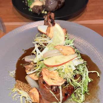 Sweet Basil - Pork tenderloin (front) + surf and turf (back) - New American Near Me - Vail, Colorado
