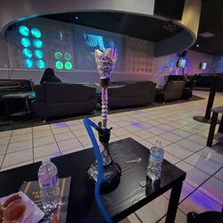 5 Sisters Restaurant - Hookah and the lounge area with the large TV