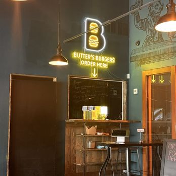 Butter's Burgers - The Butts burgers neon sign at the side food delivery door inside armstuce  brewery - Burgers Near Me - Napa, California