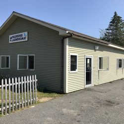 Milbridge Laundromat - This unassuming building is the laundromat.However, the sign is facing the grocery store, not Elm street so be careful not to drive by.