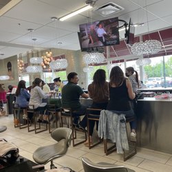 Polished Nail Bar - View from the pedicure chair. People getting manicures