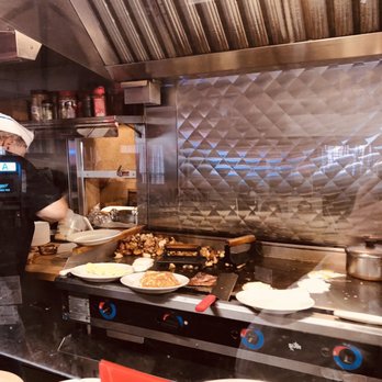Tim's Diner - The owner hard at work making folks happy in the morning - Diners Near Me - Leominster, Massachusetts