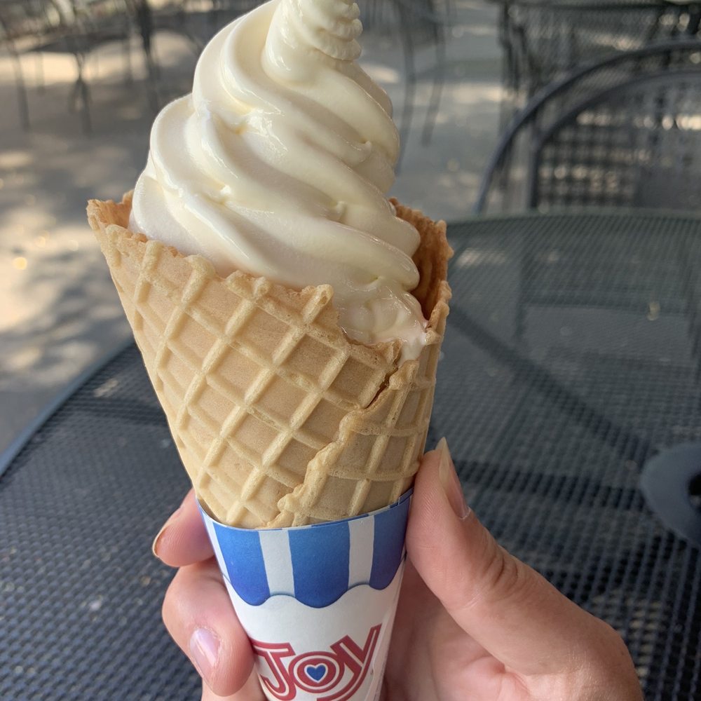 The Frosty Moose - a hand holding a cone of ice cream - Ice Cream & Frozen Yogurt Near Me - Williams Bay, Wisconsin