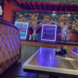 Thai & Japanese Kitchen - Table with specialty menu in the background.