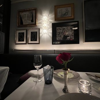 Charleston - a table set for two at a restaurant - New American Near Me - Baltimore, Maryland