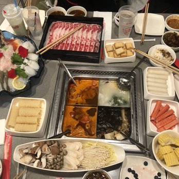Haidilao Hotpot Flushing - 2 tomato broth, 1 pork bone broth, 1 mushroom broth. - Hot Pot Near Me - Flushing, New York